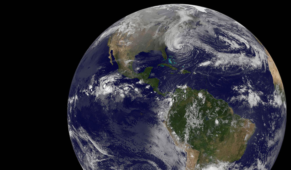 NOAA's GOES-13 satellite captured this visible image of the massive Hurricane Sandy on Oct. 28 at 1302 UTC (9:02 a.m. EDT). The line of clouds from the Gulf of Mexico north are associated with the cold front that Sandy is merging with. Sandy's western cloud edge is already over the Mid-Atlantic and northeastern U.S. Image courtesy of NASA GOES Project