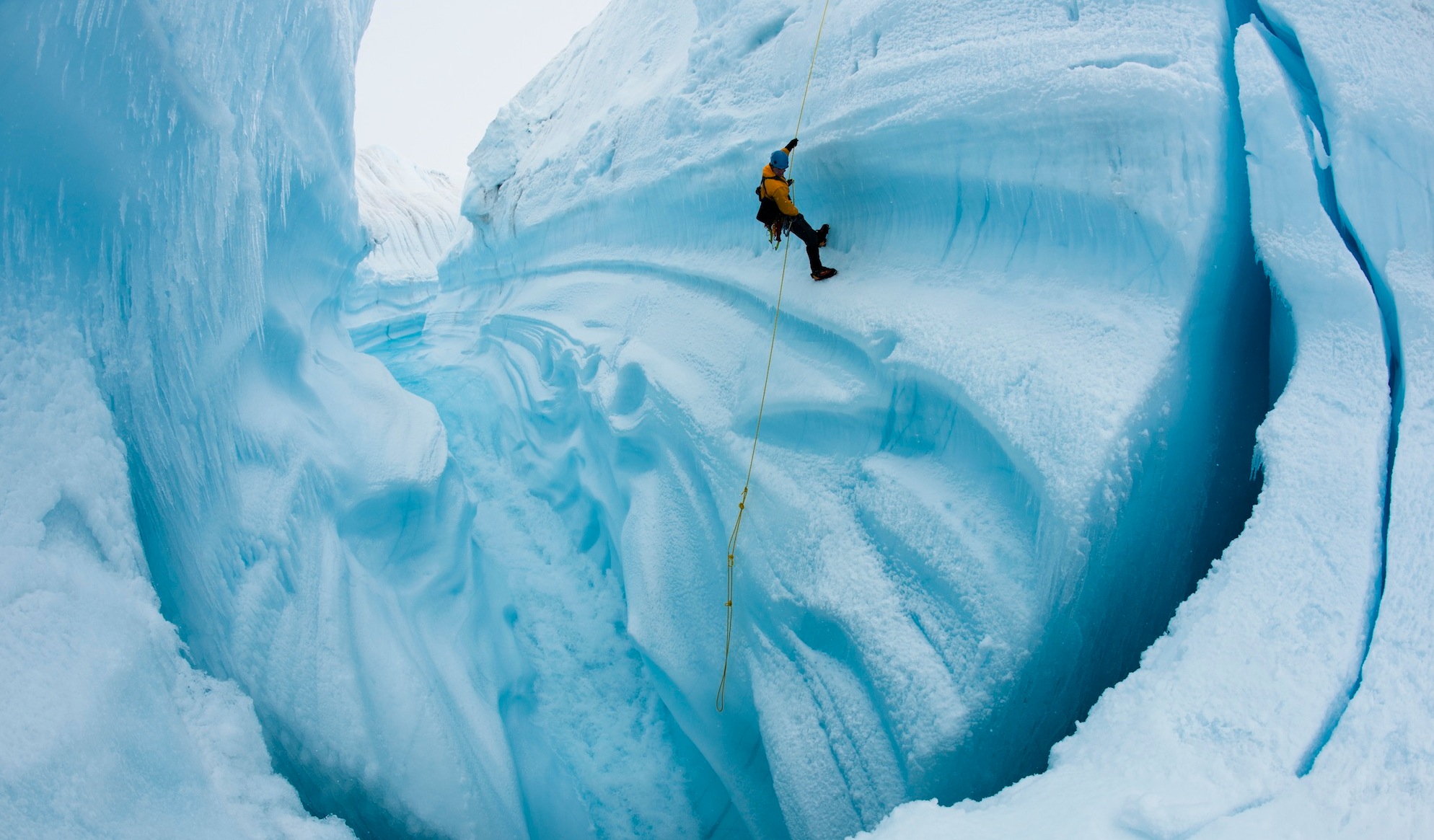 Adam LeWinter ice climbing in Survey Canyon, Greenland. Image courtesy of James Balog, Extreme Ice Survey