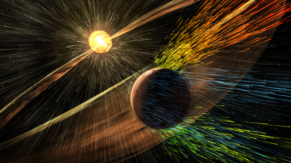Artist’s rendering of a solar storm hitting Mars and stripping ions from the planet's upper atmosphere. Image by NASA/GSFC