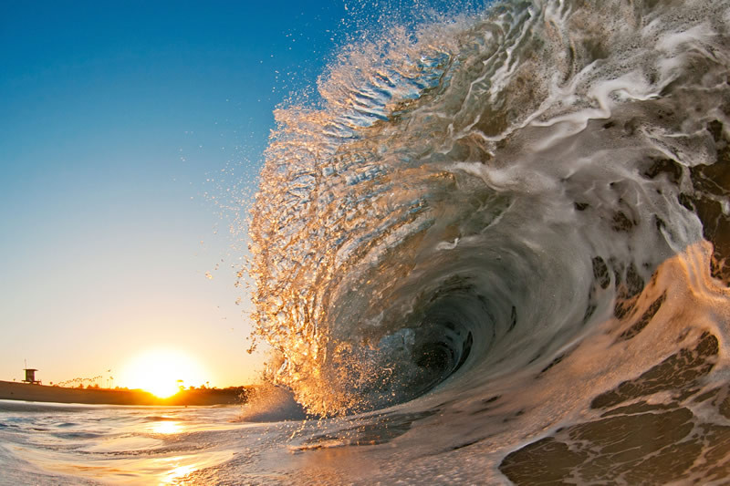 A wave washes ashore in California. Photo courtesy of Clark Little Photography