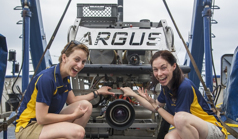 The authors Ariel Zych (left) and Rachel Rayner (right) with ROV Argus aboard the E/V Nautilus. 2015. Photo courtesy Ocean Exploration Trust