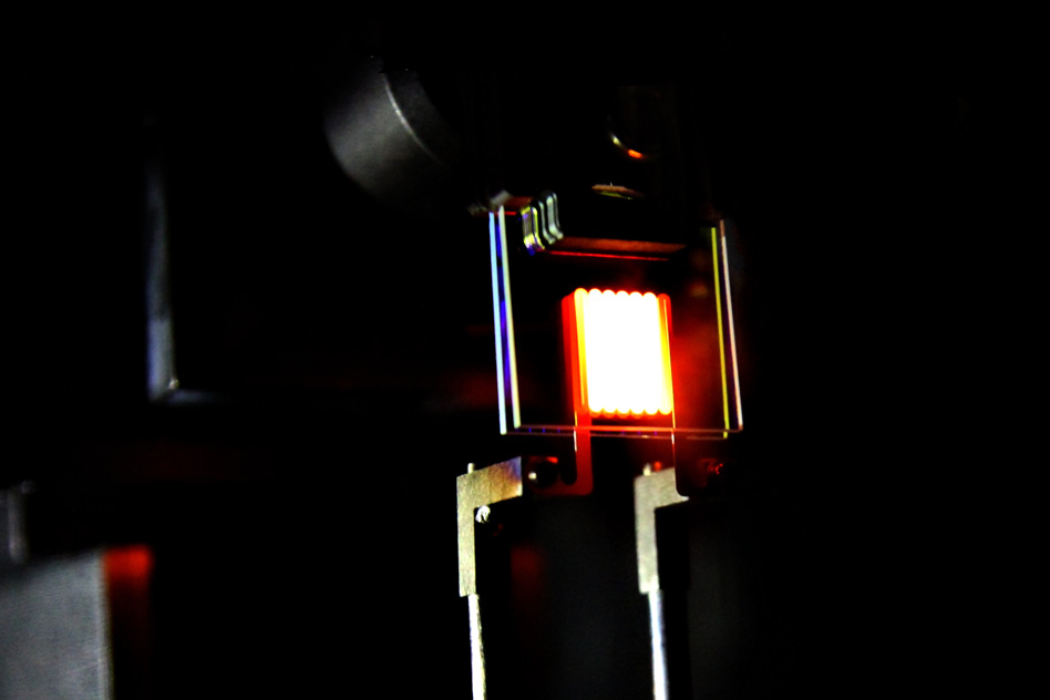 A proof-of-concept device built by MIT researchers demonstrates the principle of a two-stage process to make incandescent bulbs more efficient. This device already achieves efficiency comparable to some compact fluorescent and LED bulbs. Photo courtesy of MIT