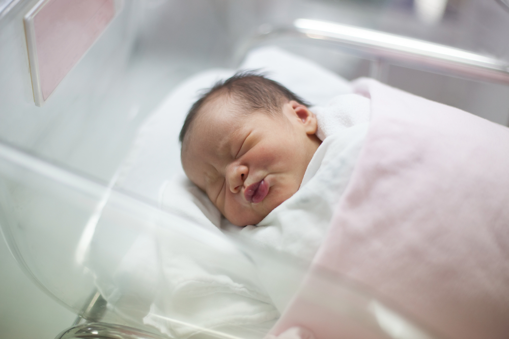 Infant in delivery room, from Shutterstock