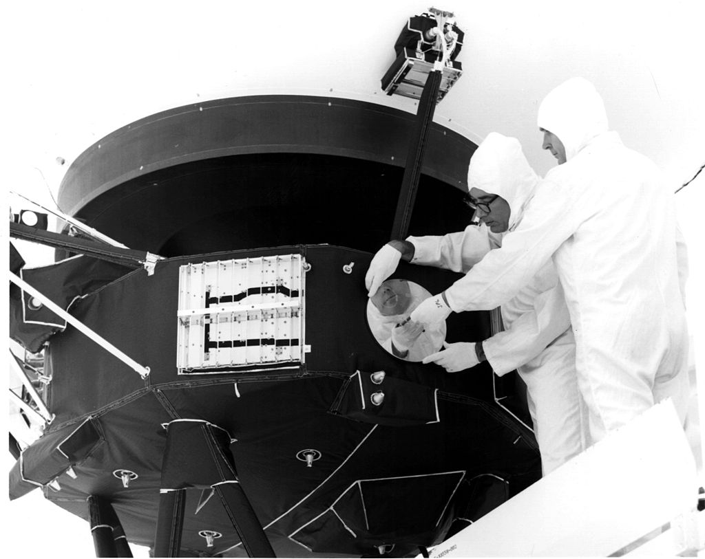 Engineers attaching the Golden Record to the Voyager spacecraft. Credit: NASA