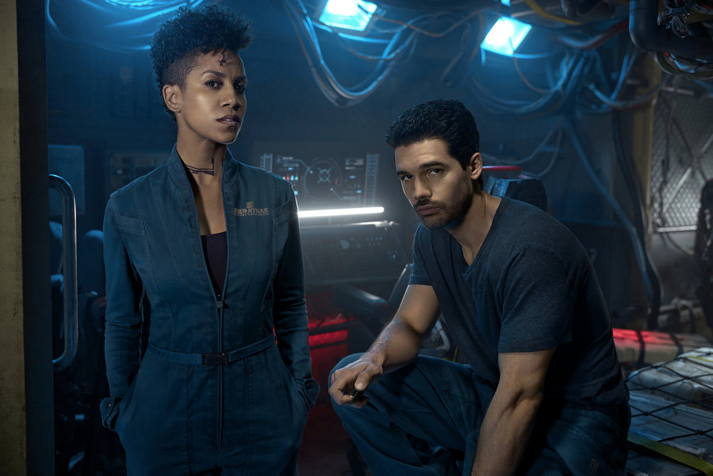 (Left to right): Dominique Tipper as Naomi Nagata, Steven Strait as Earther James Holden. Credit: Kurt Iswarienko/Syfy
