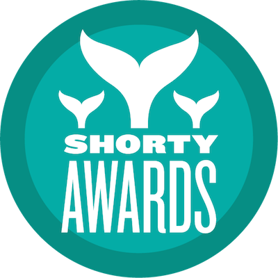 logo with three whale tales with text "shorty awards"