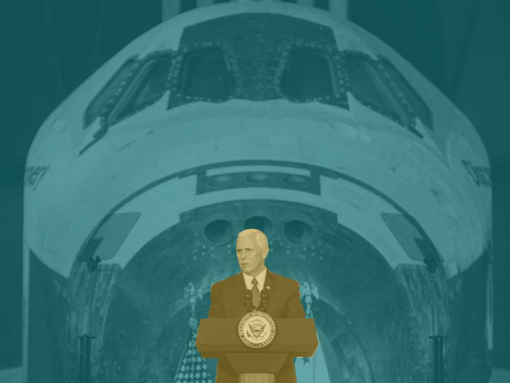 Vice President Pence standing in front of space shuttle