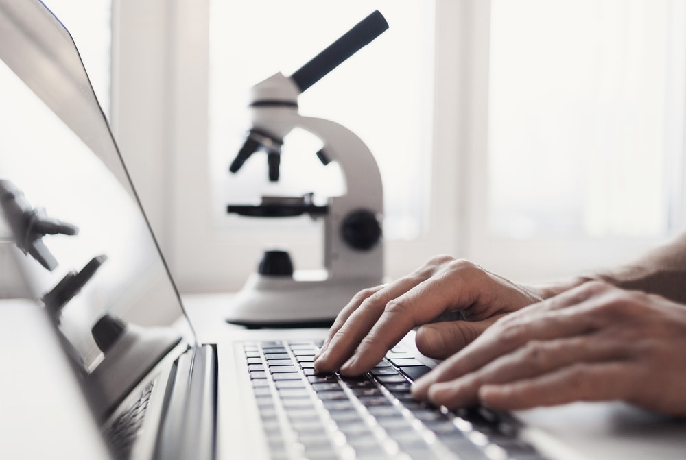 scientist at computer at home