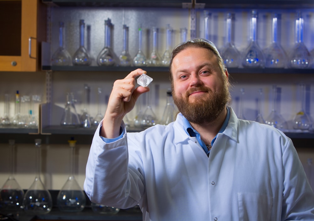 jason benedict holding a previous contest crystal