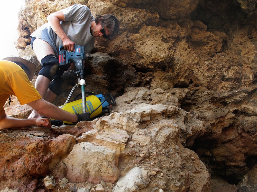 the researchers drilling to get samples