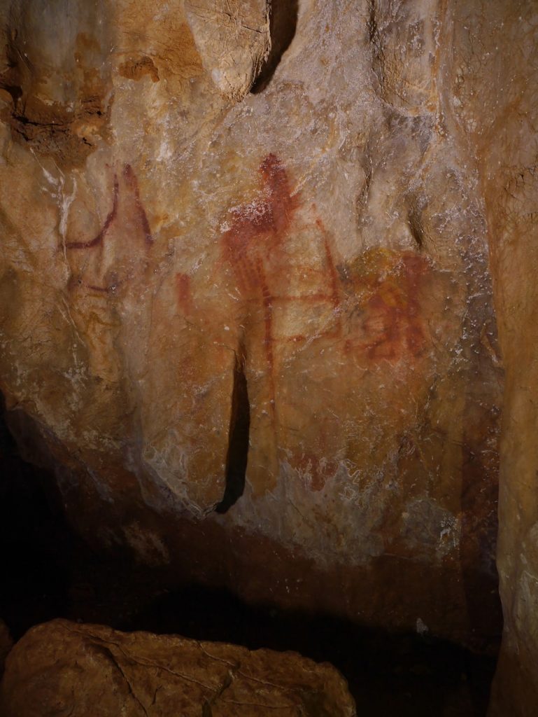 ladder shape painting and you can barely make out the shape of some animals painted