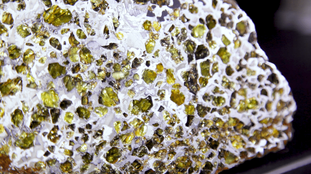yellow gem speckles in rocky surface