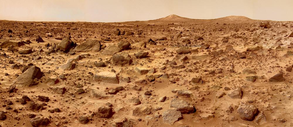 ground level shot of rough, red surface of Mars