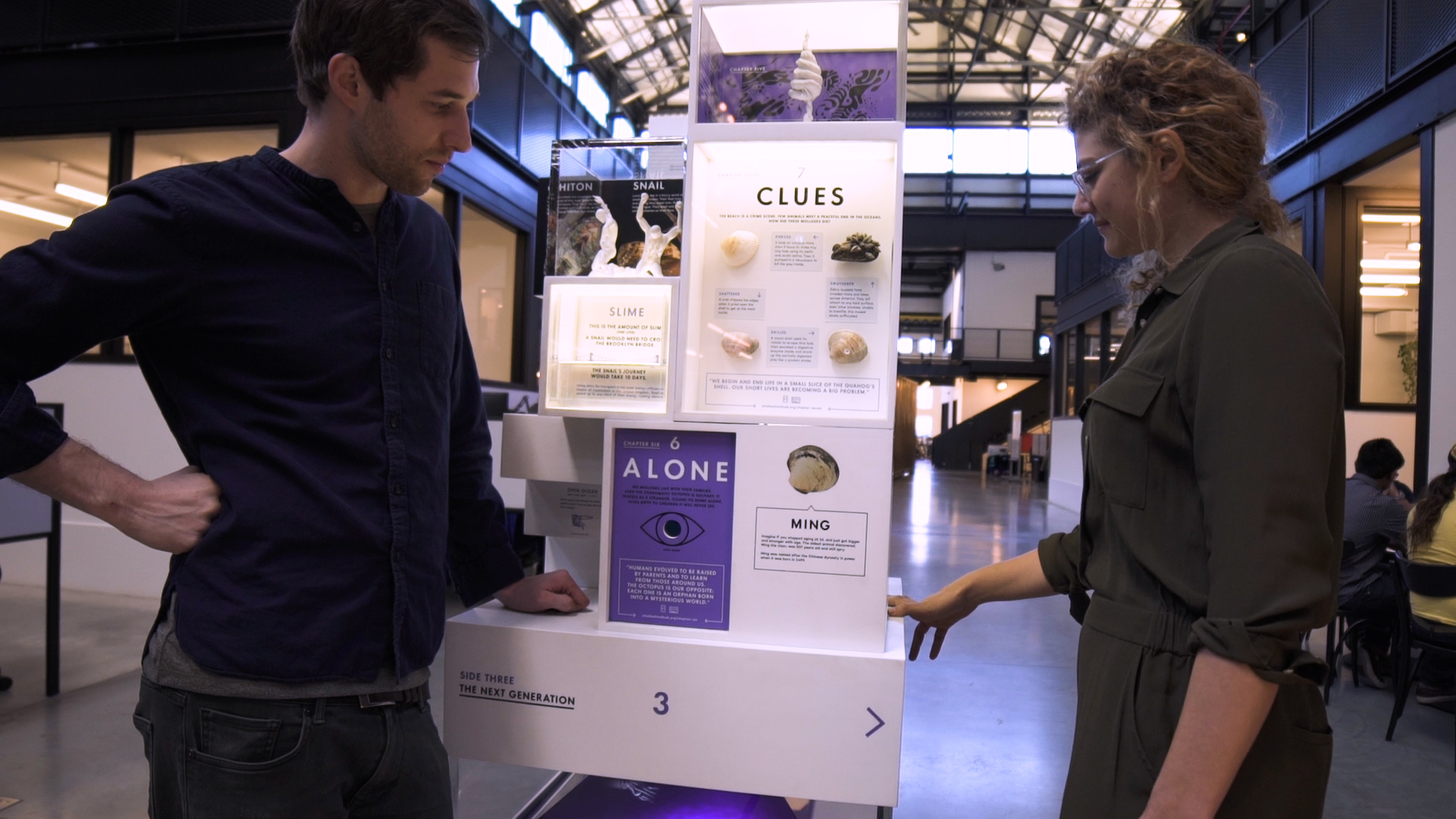 Amanda and her partner Charles standing next to the mollusk museum