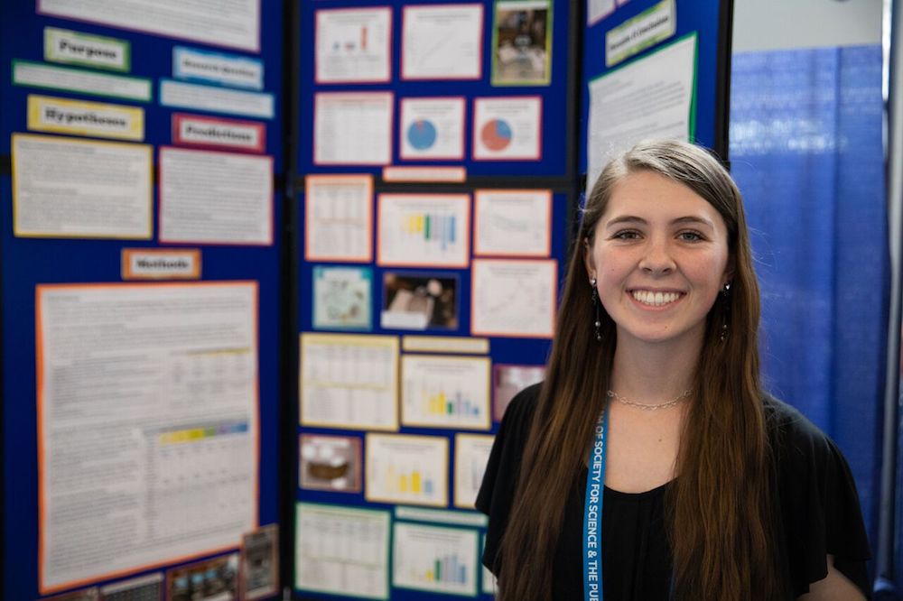 Alyssa Rawinski stands in front of her project at the fair