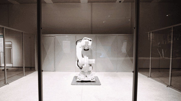 a white robotic arm unfolds and zooms up to the camera