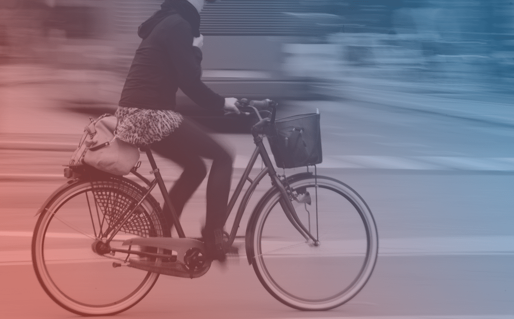 biker in a city, blue and red filter