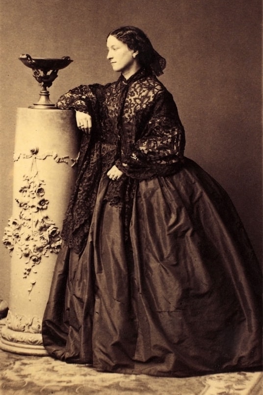 a vintage sepia tinted photograph of a woman (jeanne villepreux-power) in a dress