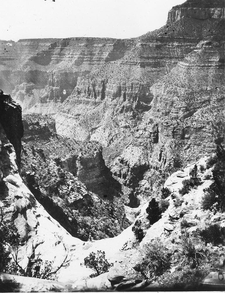 a black and white photograph of the grand canyon back when it was first explored in the 1800s