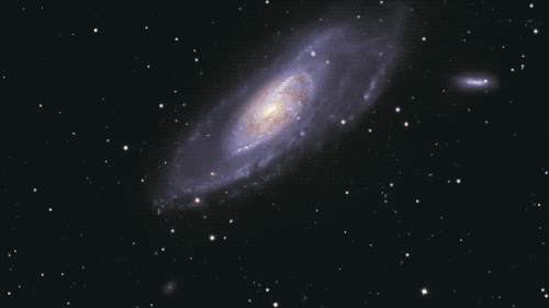 video zooming in on purplish galaxy in space