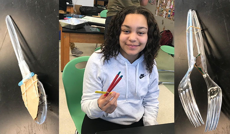 a student holding their designed beak