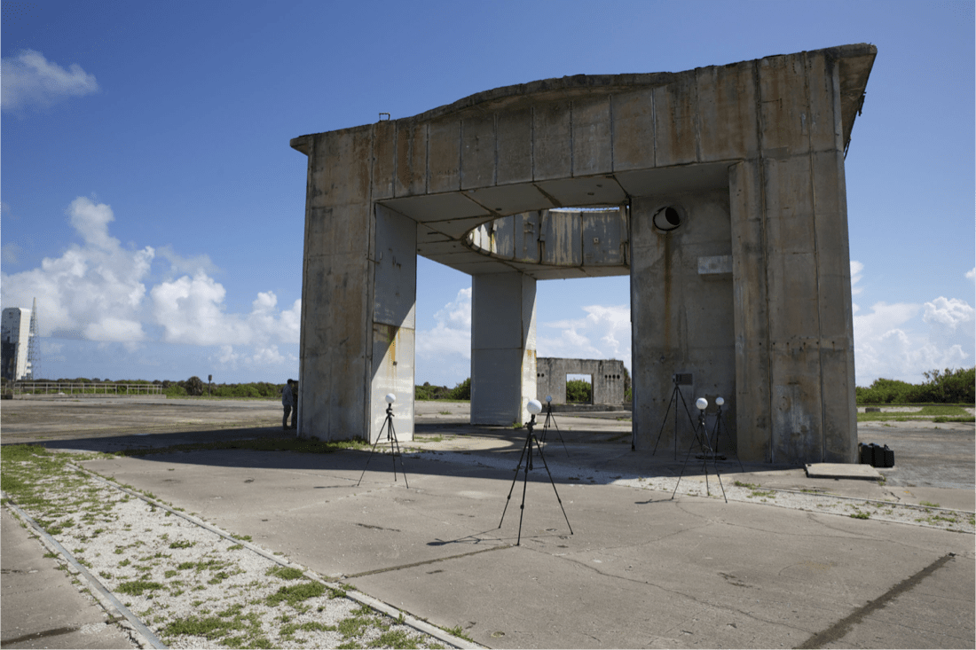 gray structure on four legs against blue sky