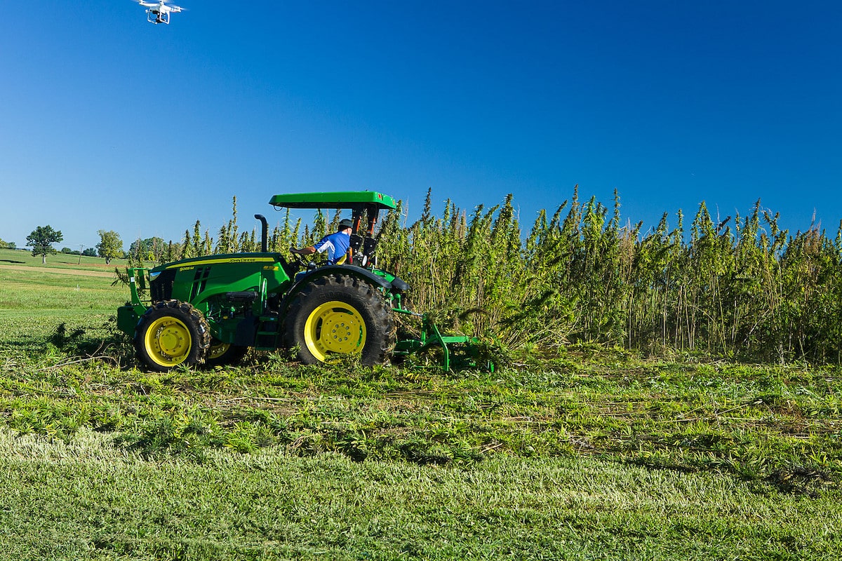 tractor in a field cutting crops