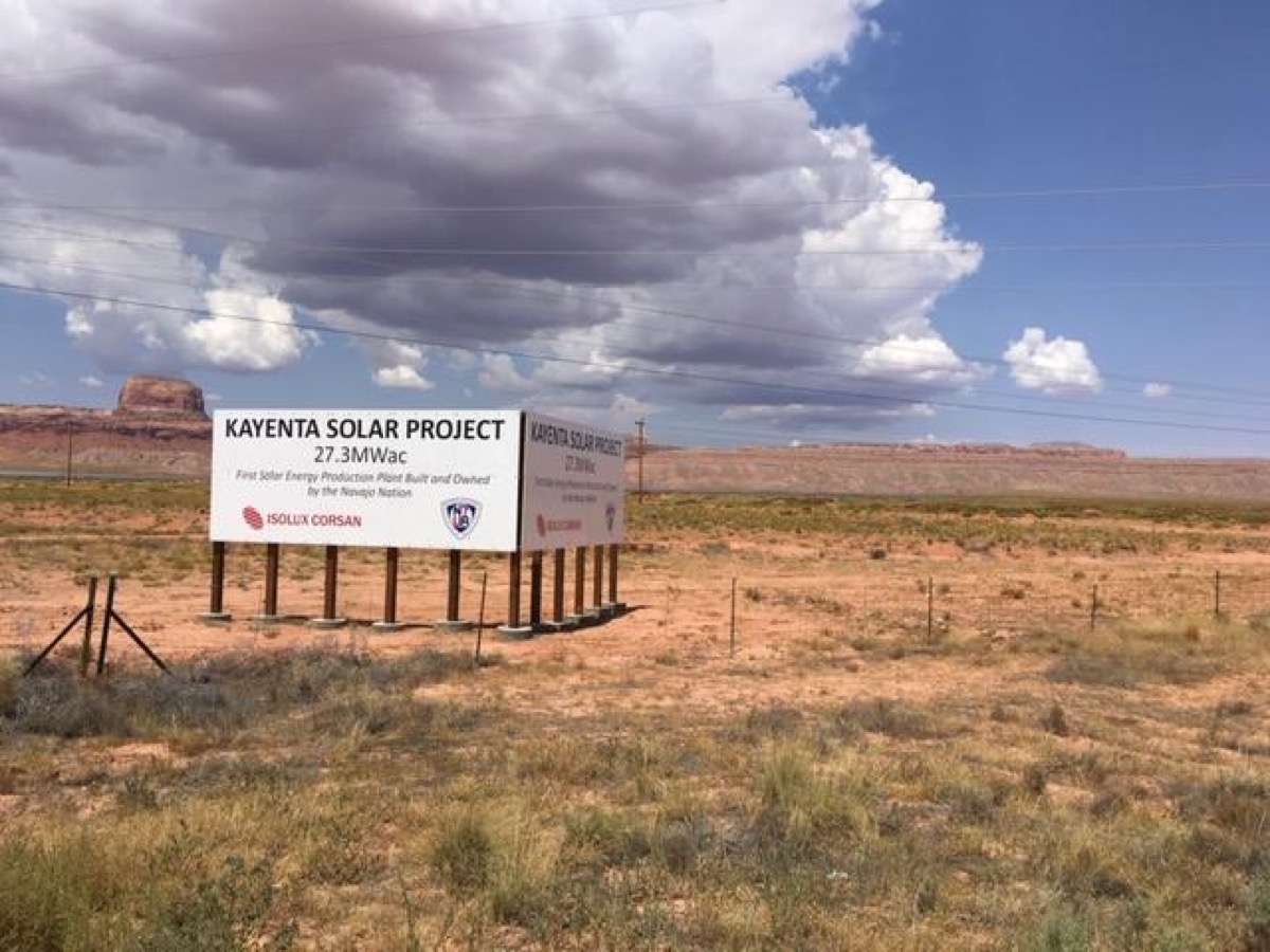 a billboard reading "kayenta solar project, 27.3MWac" in a desert 