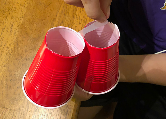 two cups with the bottoms cut taped together