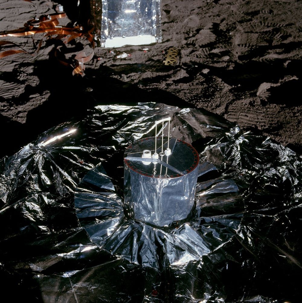 silver shiny equipment on the surface of the moon