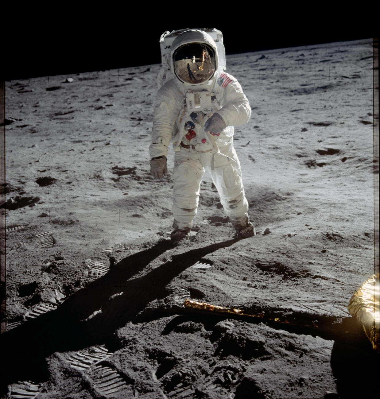 an astronaut stands on the moon