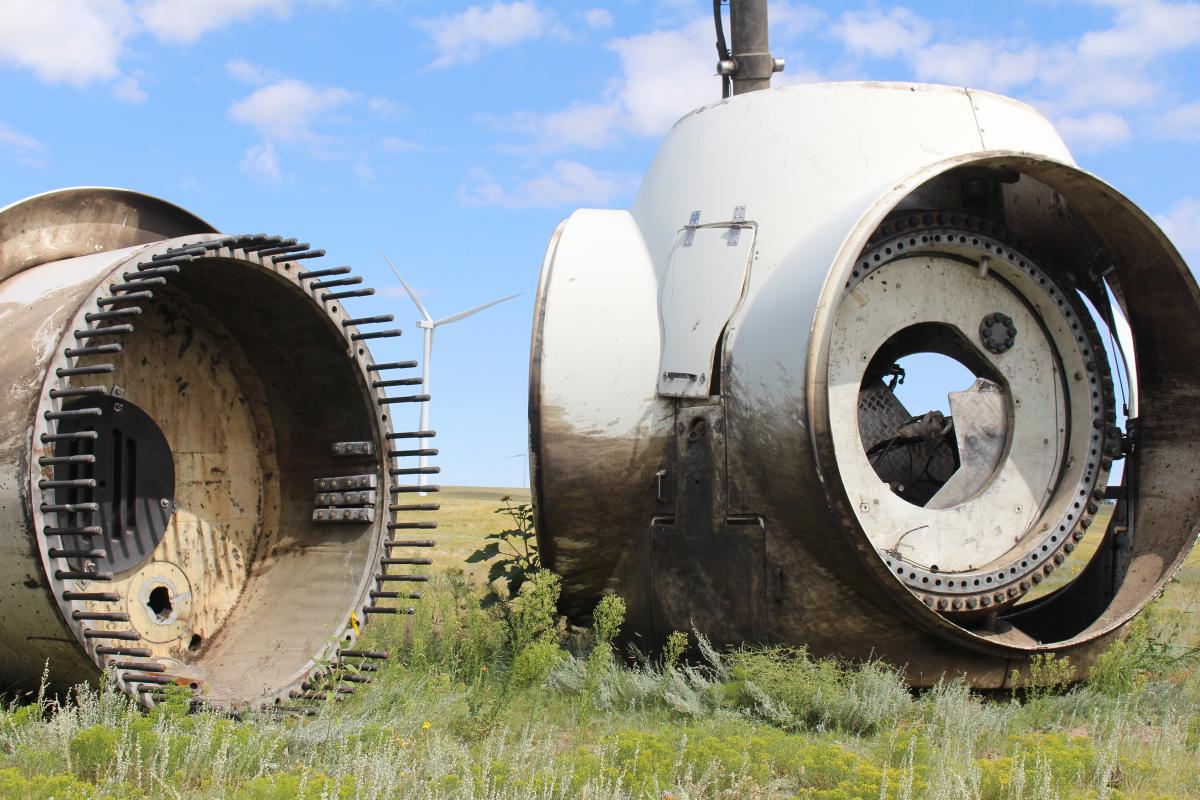 discolored remains of a wind turbine on the ground