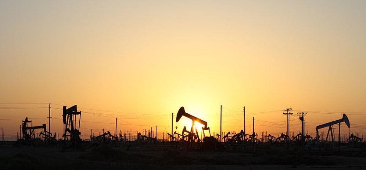 Pumpjacks on Lost Hills Oil Field in California on Route 46 at sunset.