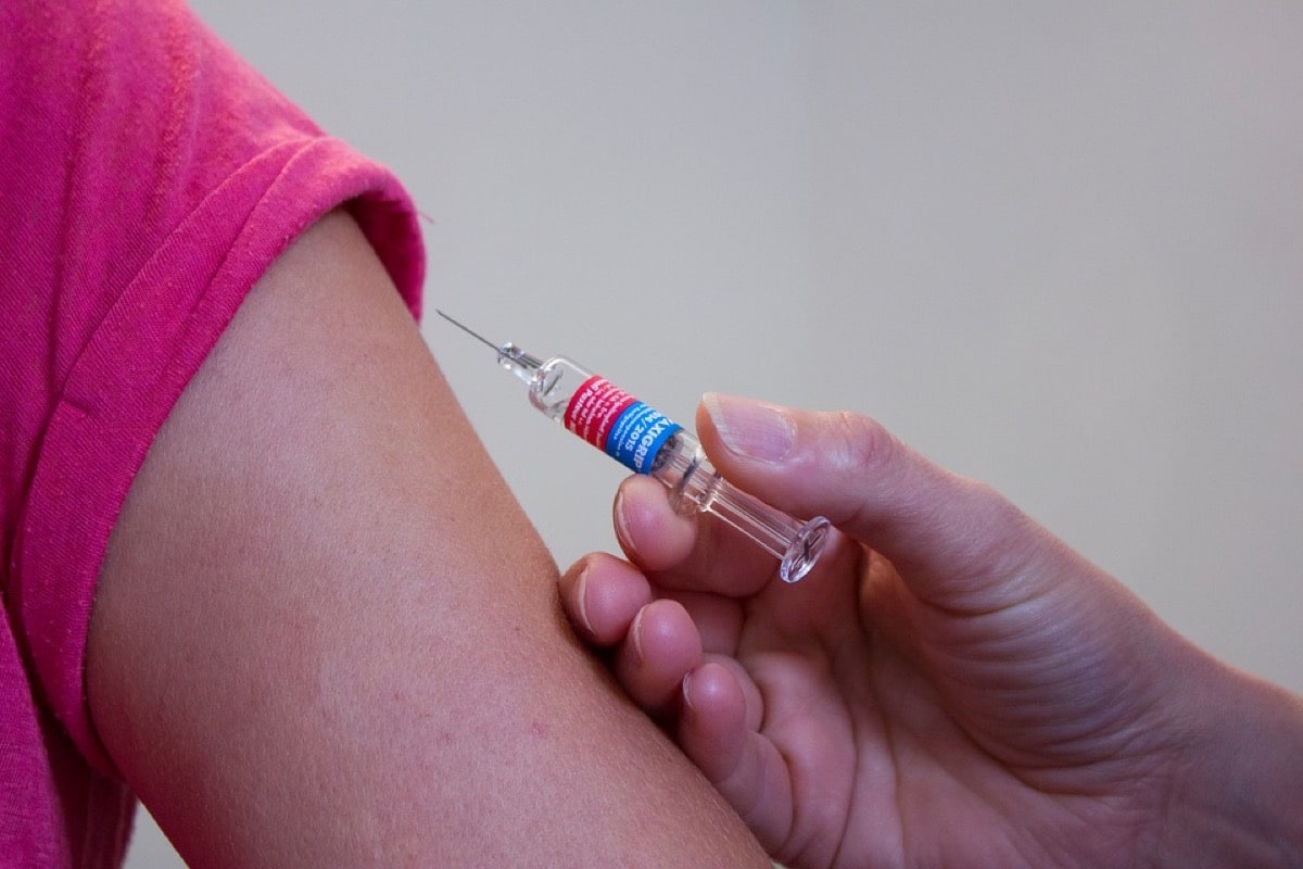 Child's arm receiving a vaccine 