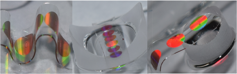 three different shots of an iridescent circle on a clear pliable, bending substrate
