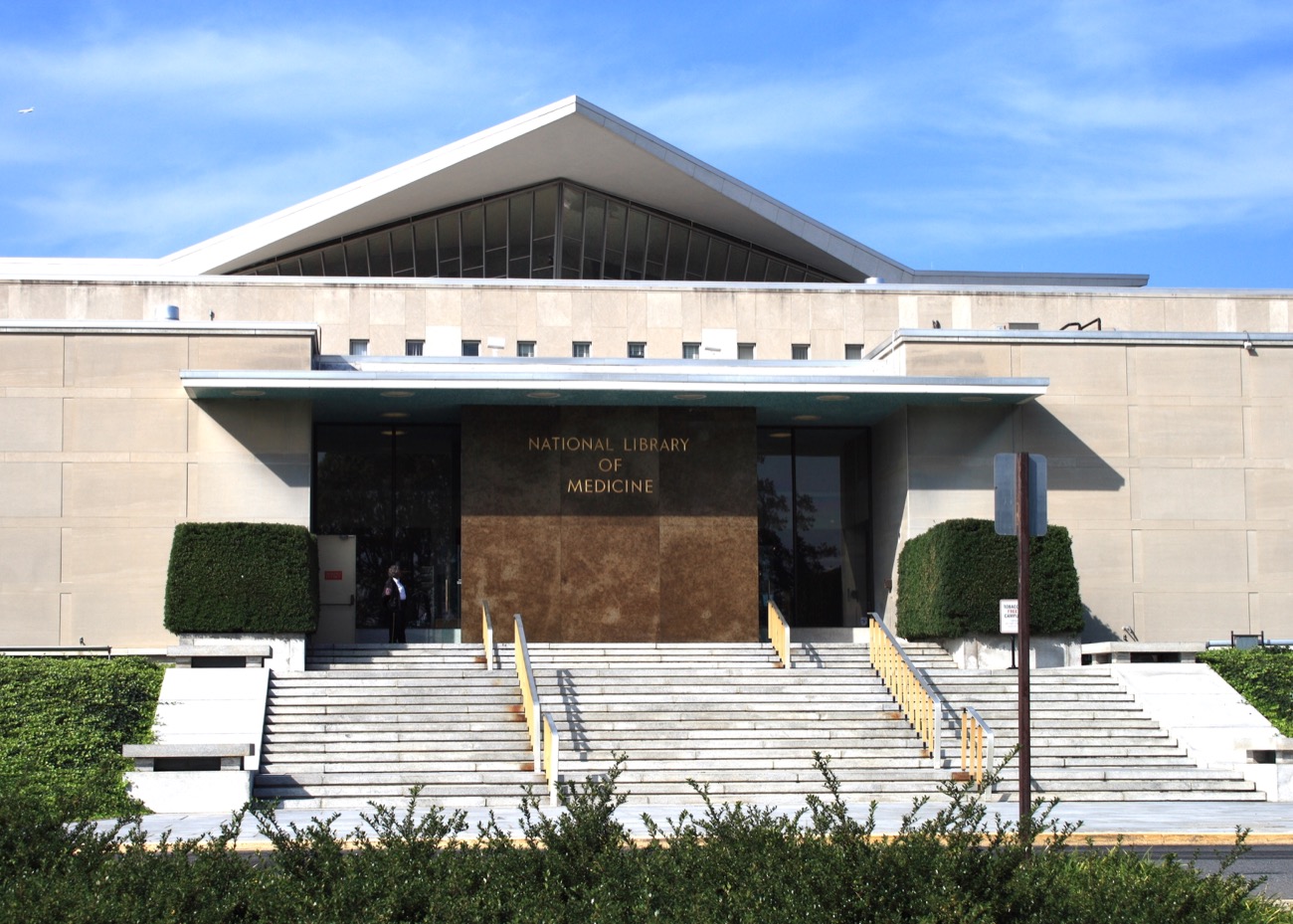 the front of a large building with a pointed roof