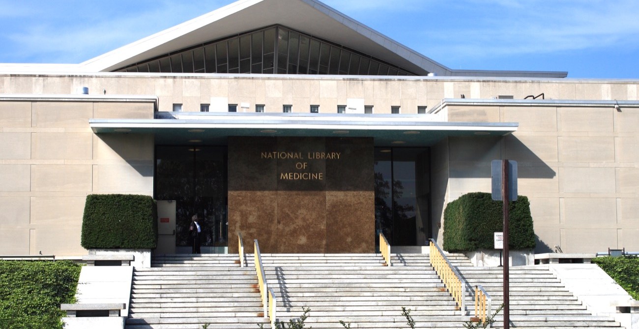 the front of a large building with a pointed roof