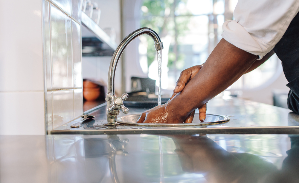 a person washing hands