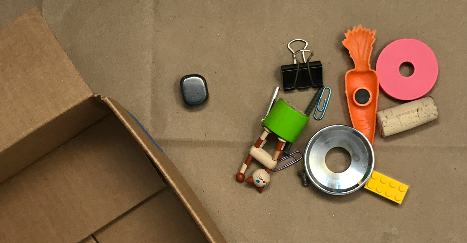 A mix of small toys and random metal and plastic objects