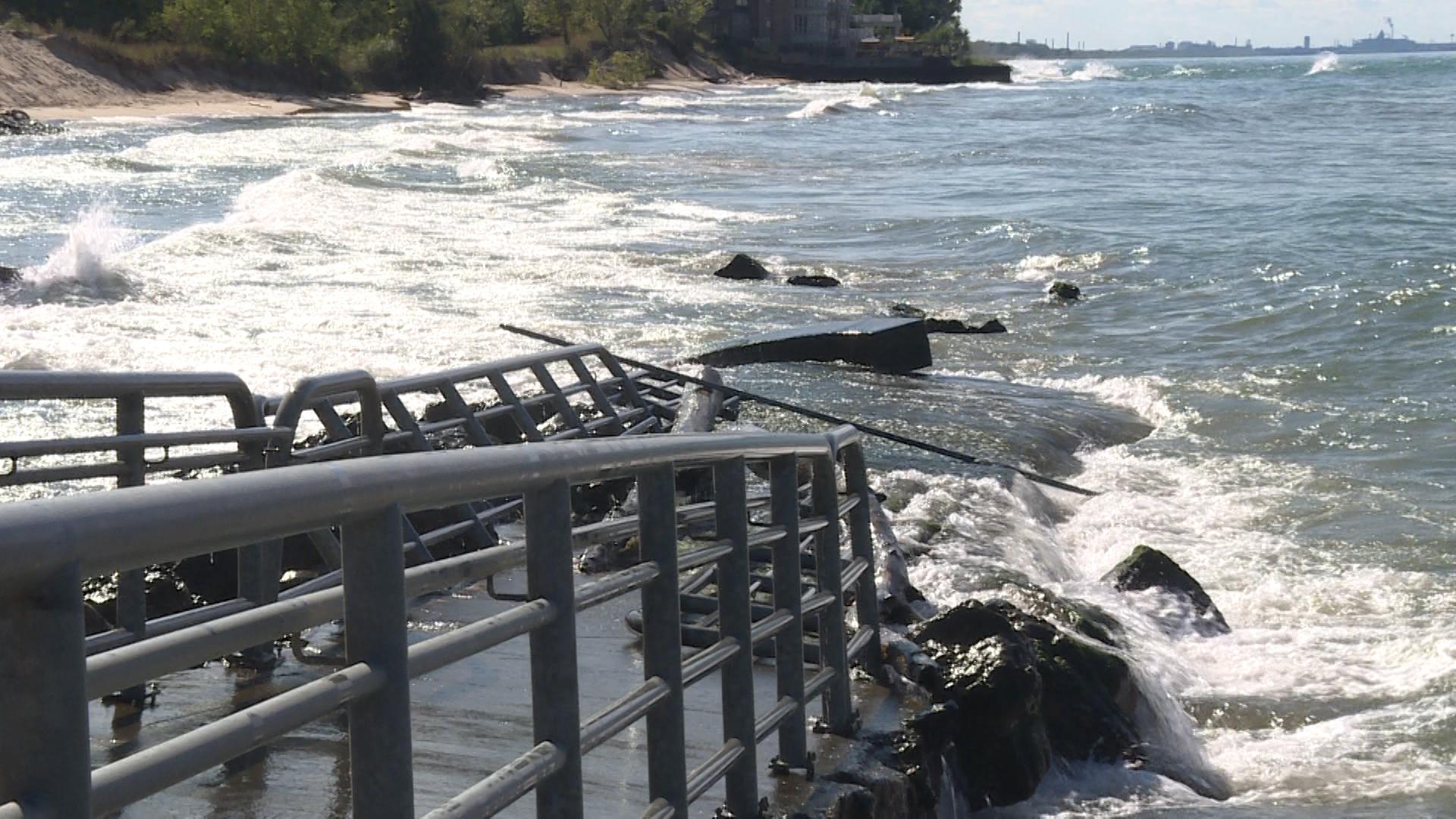 an iron walkway going into a lake, partially submerged