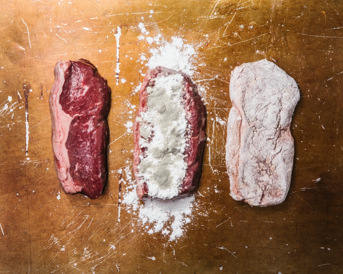 three slices of meat. one is raw and plain, the second is raw and dusting with white powder and brown mold, the third is raw but the seasoning is rubbed in