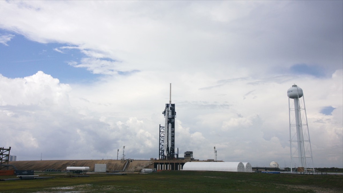 a rocket on a launch pad on a cloudy day