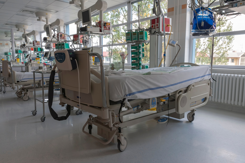 a row of empty hospital beds