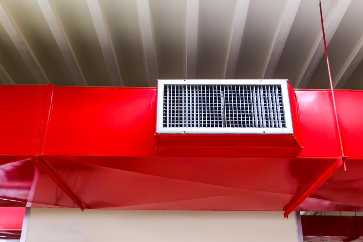 a red air vent inside a building