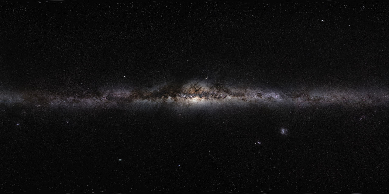 a linear stretch of clouds illuminated by glowing stars. a panoramic view of the milky way galaxy