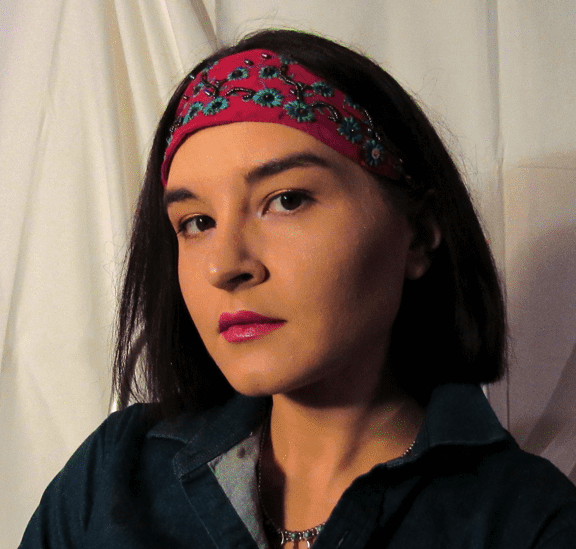 an Indigenous woman wearing a headband