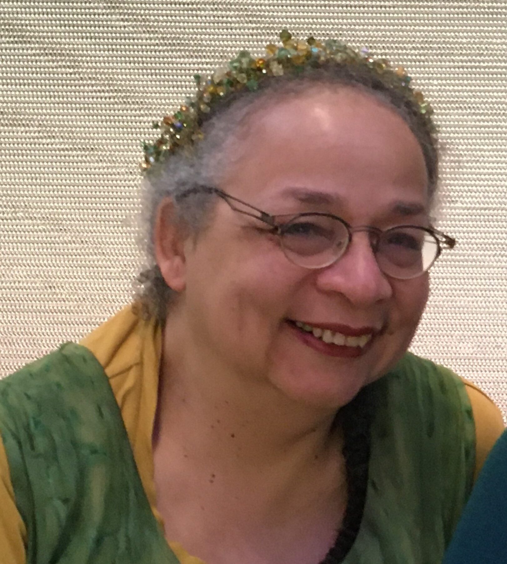 a person wearing a beaded crown