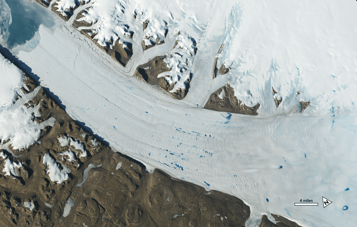 an aerial view of a glacier's movement and its deposit melt