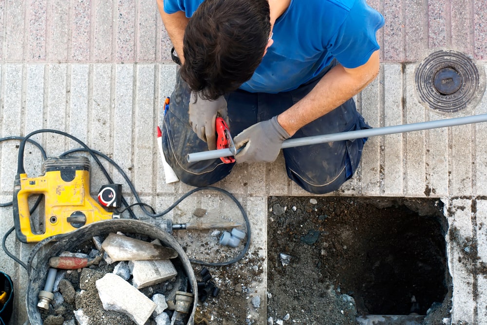 plumber worker repair and replace water pipes because of a break in pipes