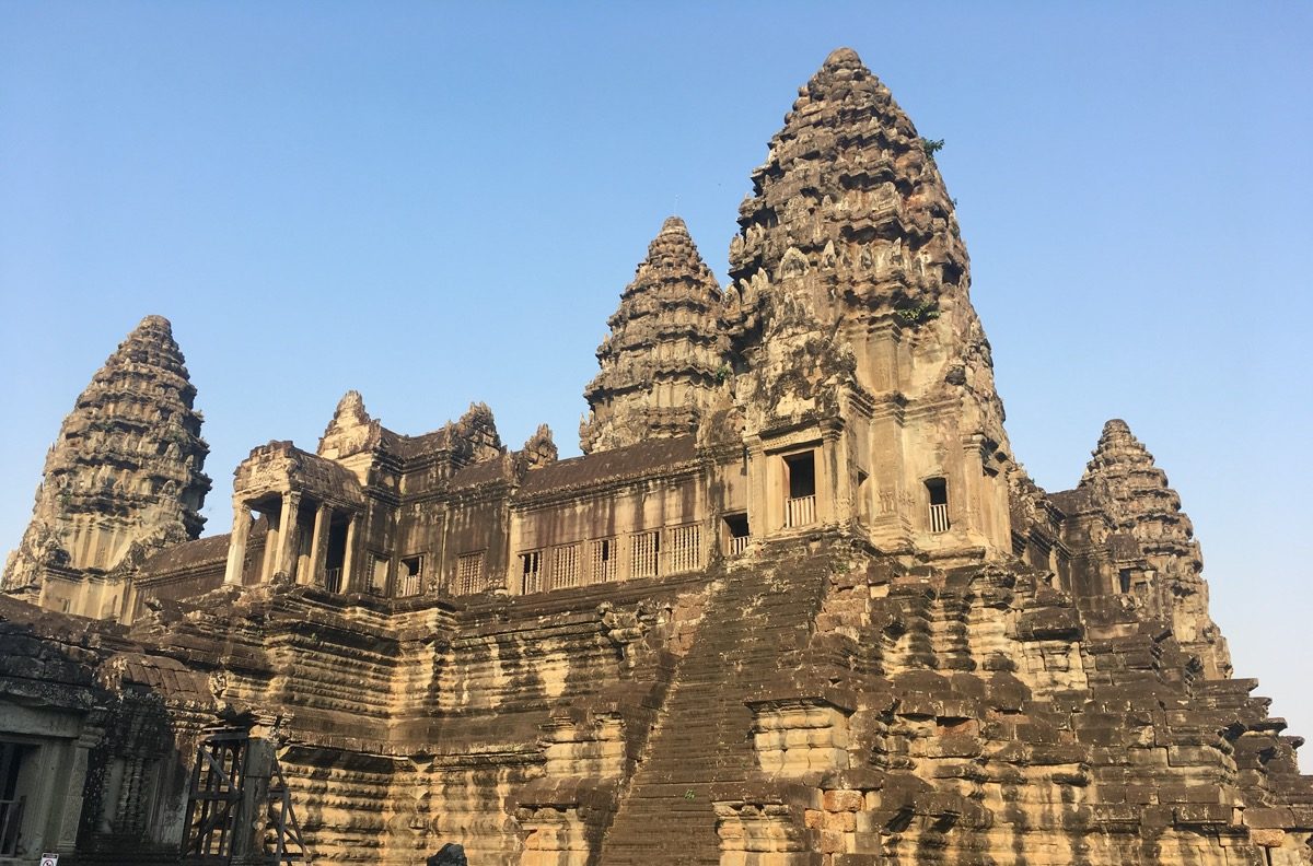 an ancient stone temple with various intricate towers and turrets